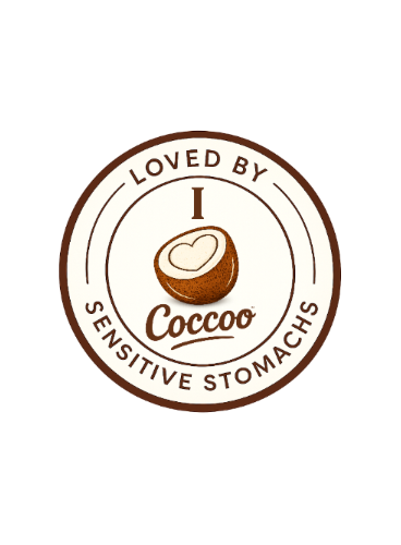 A circular brown and cream graphic with the text 'LOVED BY I Coccoo SENSITIVE STOMACHS' and a cut coconut illustration featuring a heart.